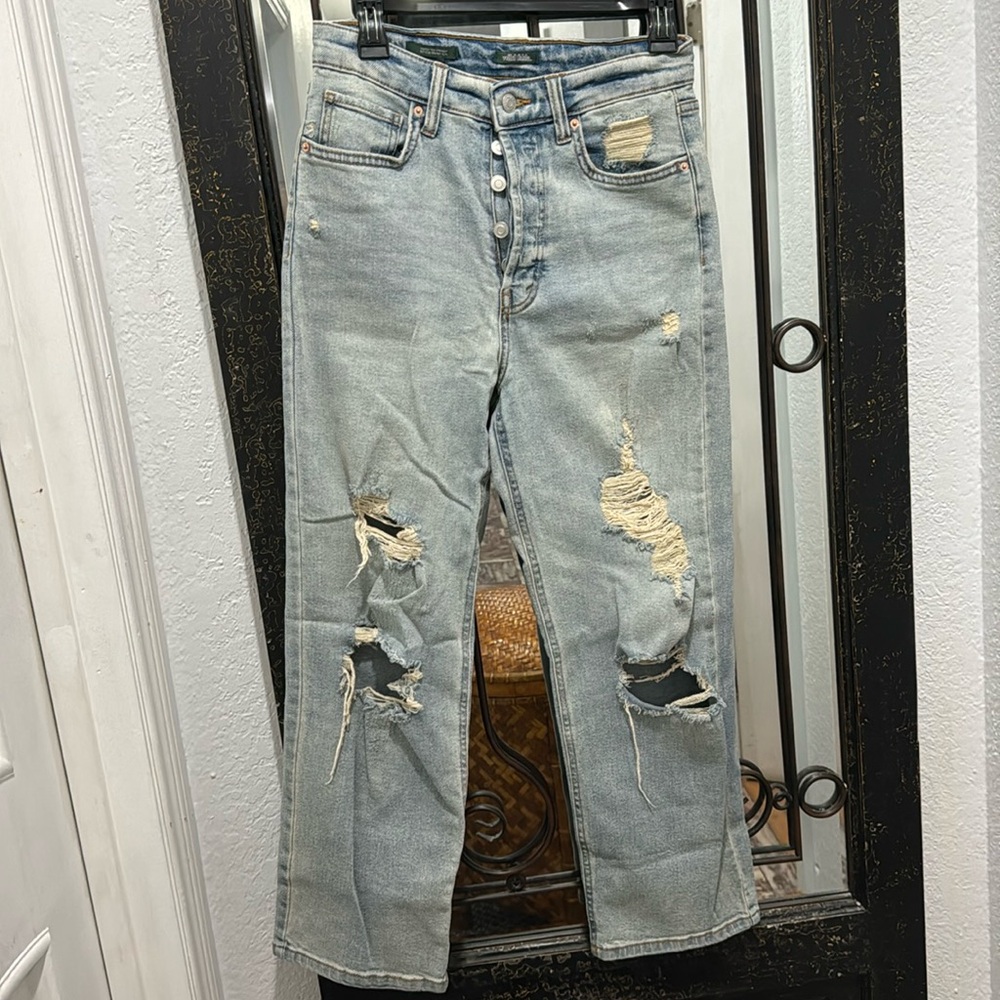 distressed button up jeans